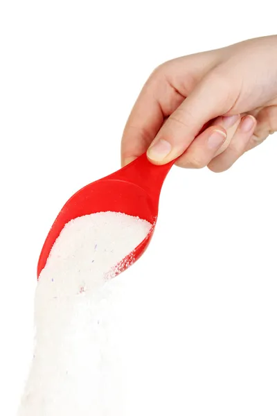 Tazza di misura con polvere di lavaggio in mano isolata su bianco — Foto Stock