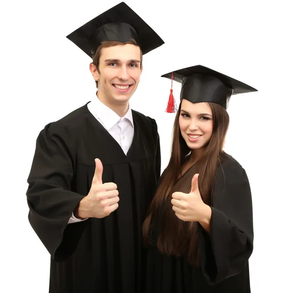 Twee gelukkige afstuderen studenten geïsoleerd op wit — Stockfoto