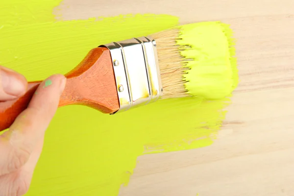 Brush painting wooden furniture, close up — Stock Photo, Image