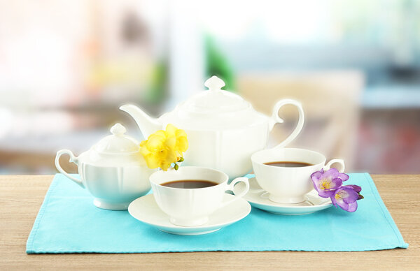 Beautiful tea service on wooden table