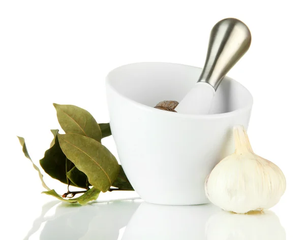 Mortar, herbs and garlic, isolated on white — Stock Photo, Image