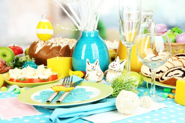 Serving Easter table with tasty dishes on room background — Stock Photo, Image