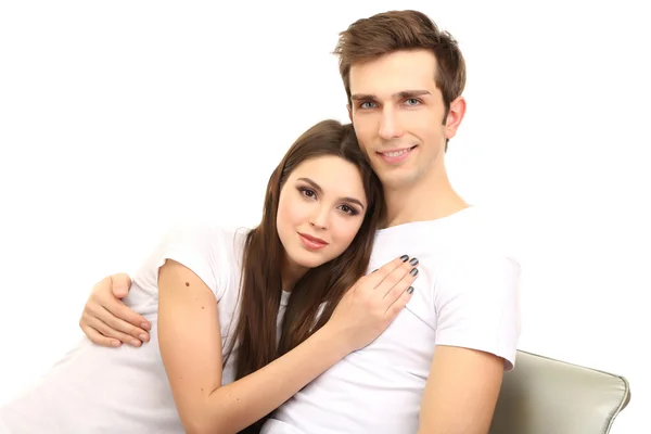 Jovem casal sentado juntos isolado no branco — Fotografia de Stock