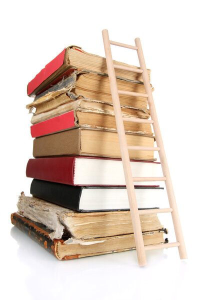 Old books and wooden ladder, isolated on white