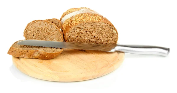 Bread with sesame seeds and knife on wooden board isolated on white — Stock Photo, Image