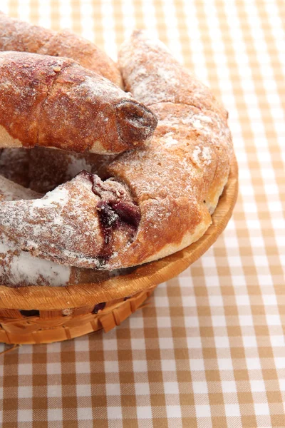 Taste croissants in basket on tableclot — Stock Photo, Image