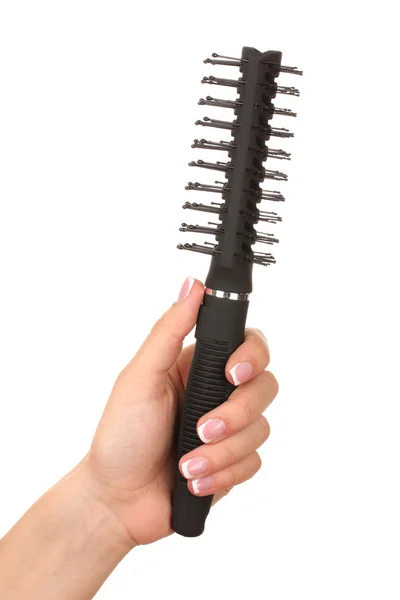 Black comb in female hand isolated on white — Stock Photo, Image