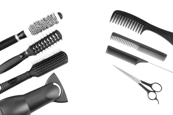 Comb brushes, hairdryer and cutting shears, isolated on white — Stock Photo, Image