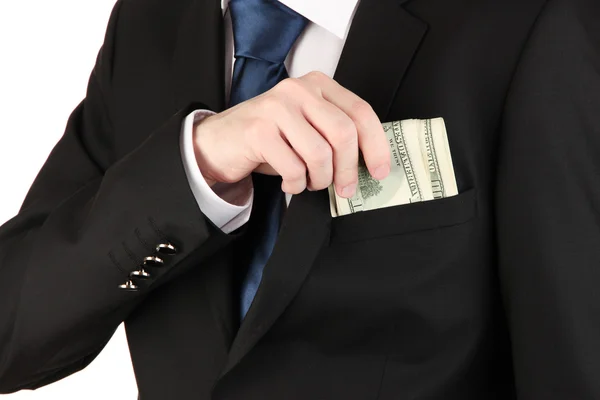 Hombre de negocios escondiendo dinero en el bolsillo aislado en blanco — Foto de Stock