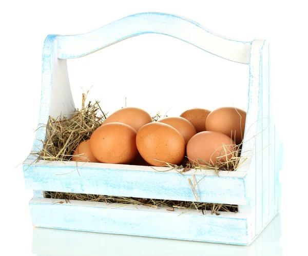 Easter eggs in wooden basket isolated on white — Stock Photo, Image