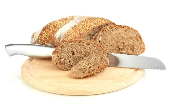 Bread with sesame seeds and knife on wooden board isolated on white — Stock Photo, Image