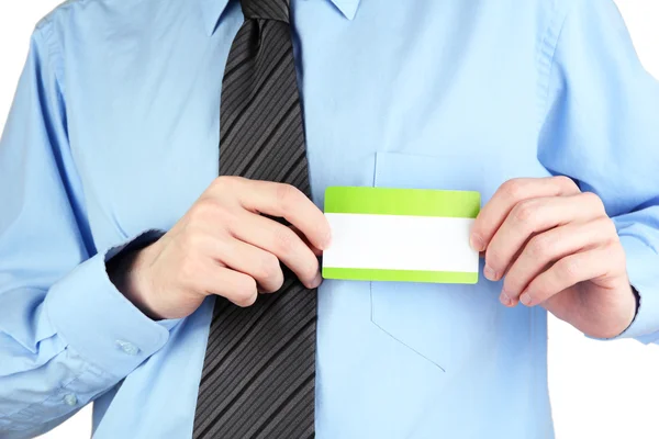 Empresário vestindo camisa azul com gravata e segurando nametag em branco de perto — Fotografia de Stock