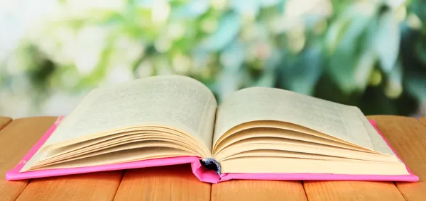 Opened book on bright background — Stock Photo, Image