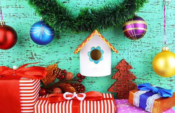 Nesting box and Christmas decoration on blue background — Stock Photo, Image