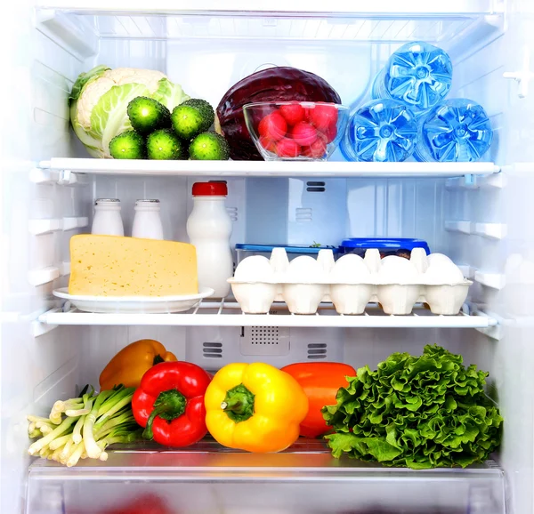Refrigerator full of food Stock Picture