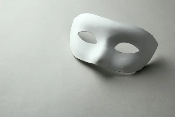 White mask, on grey background — Stock Photo, Image