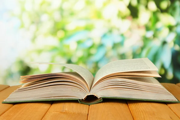 Opened book on bright background — Stock Photo, Image