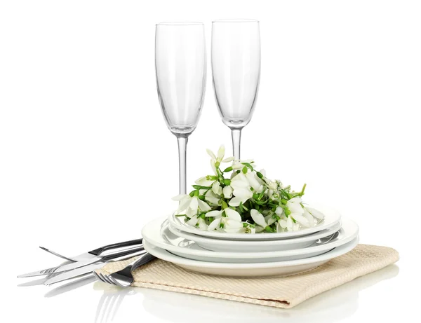 Serving dishes and snowdrops isolated on white — Stock Photo, Image