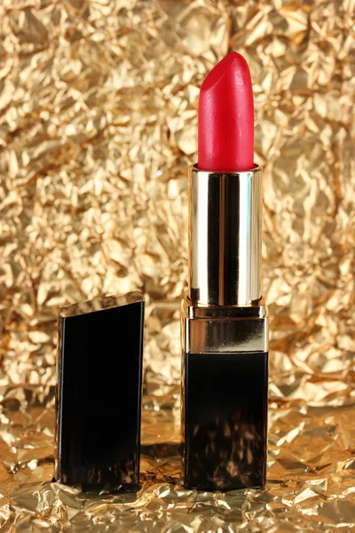 Beautiful lipstick on golden background — Stock Photo, Image