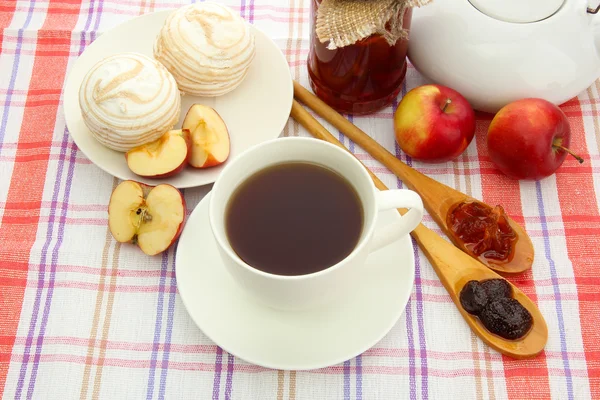 Light breakfast with tea and homemade jam, on tablecloth — Stock Photo, Image