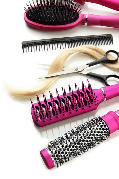 Comb brushes, hair and cutting shears, isolated on white — Stock Photo, Image