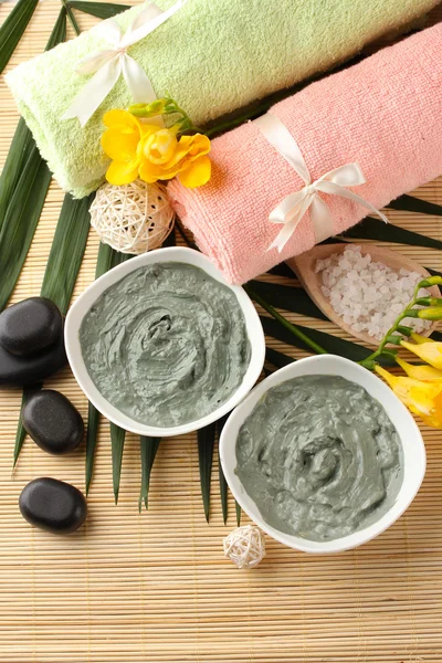 Composition with cosmetic clay for spa treatments, on bamboo background — Stock Photo, Image