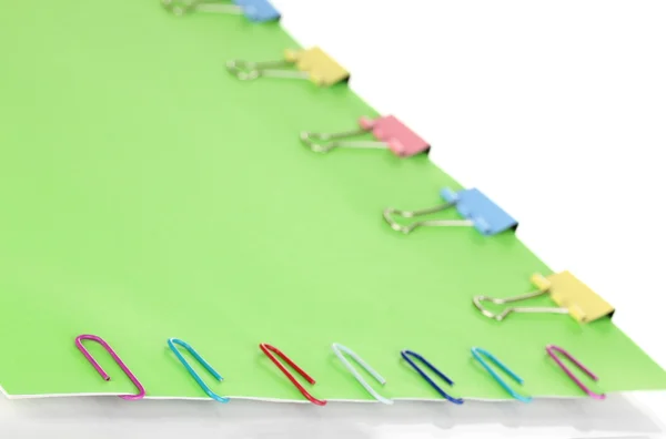 Green paper with binder and paper clips close up — Stock Photo, Image