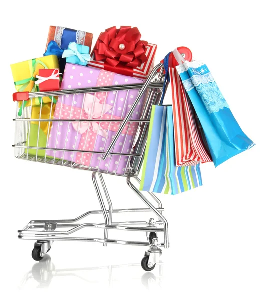 Christmas gifts and shopping in trolley isolated on white — Stock Photo, Image