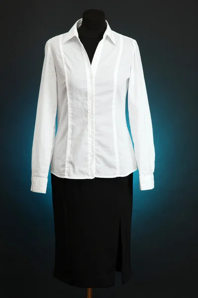 White blouse and black skirt on mannequin on dark color background — Stock Photo, Image