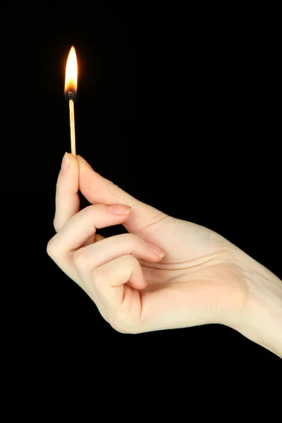 Burning lighter in female hand, isolated on black — Stock Photo, Image