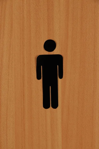 Toilet sign on wooden background — Stock Photo, Image