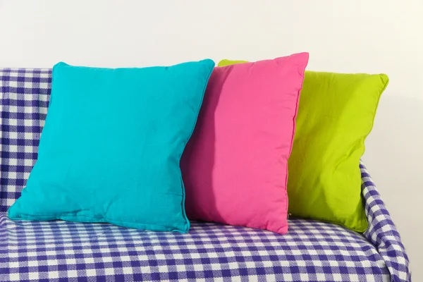 Colorful pillows on couch isolated on white — Stock Photo, Image