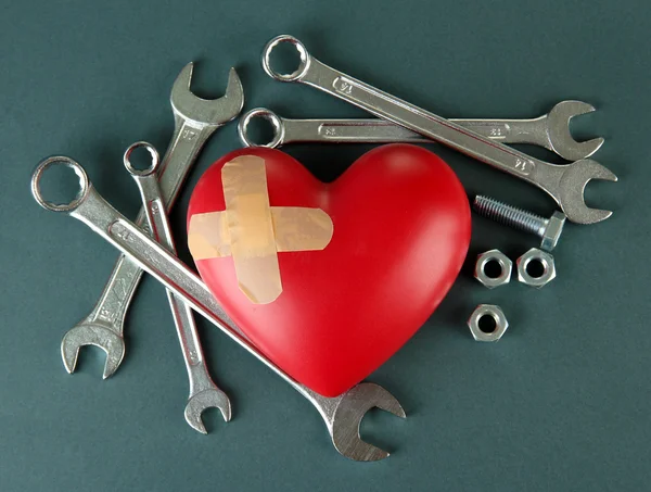 Heart and tools. Concept: Renovation of heart. Isolated — Stock Photo, Image