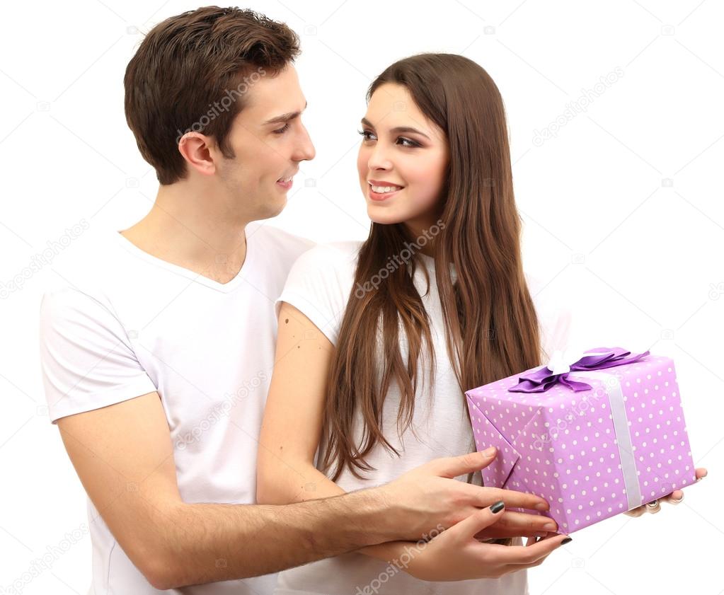 Loving couple with gift isolated on white
