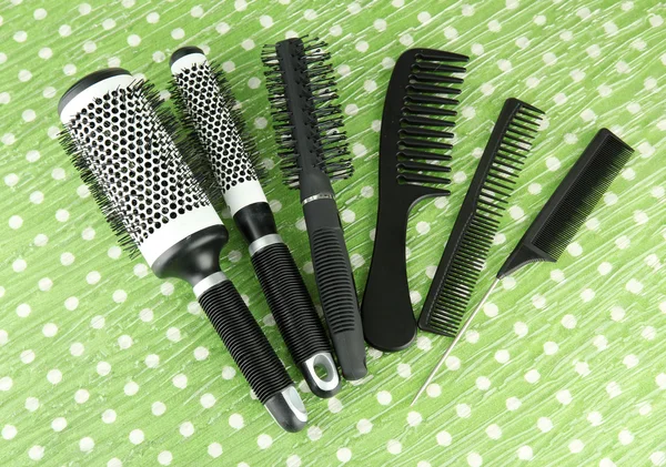 Black combs on color background — Stock Photo, Image