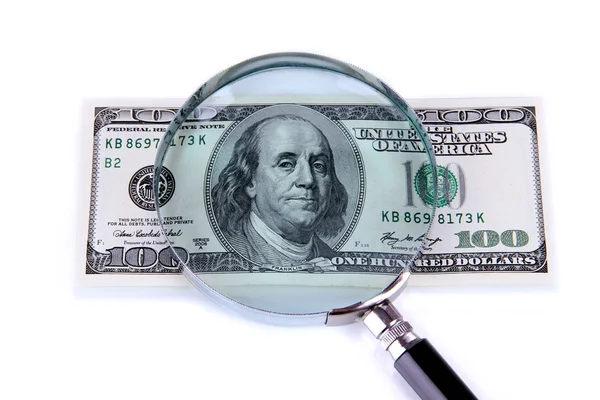 Hundred dollar bill and magnifying glass isolated on white — Stock Photo, Image