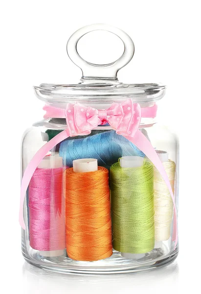 Glass jar containing various colored thread isolated on white — Stock Photo, Image