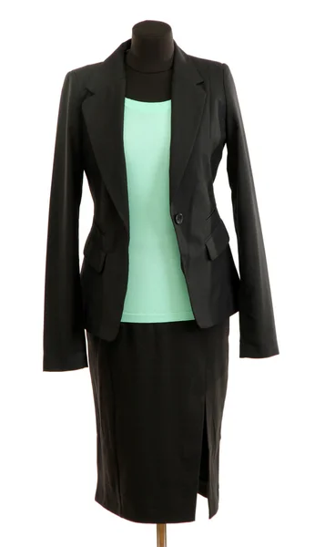 Turquoise blouse and black skirt with coat on mannequin isolated on white — Stock Photo, Image