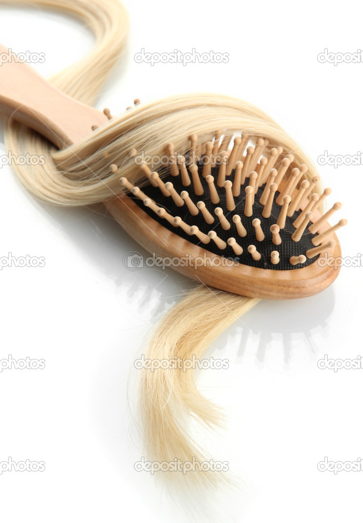 wooden comb brush with hair, isolated on white