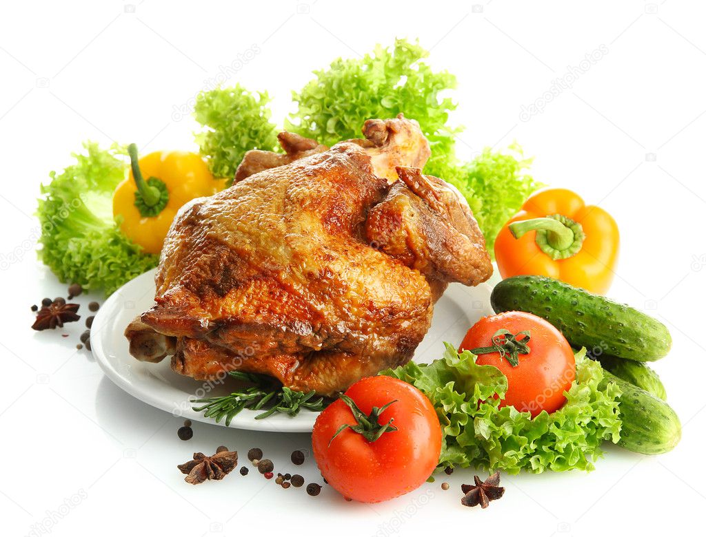 Tasty whole roasted chicken on plate with vegetables, isolated on white