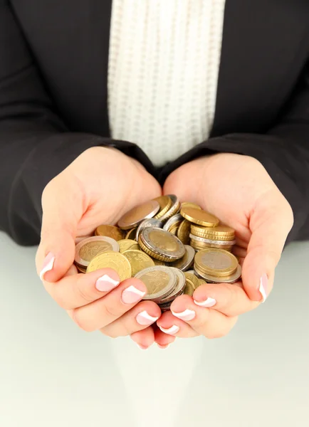 Woman hands with coins isolated on whit — Stock Photo, Image