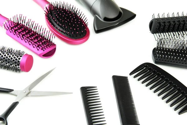 Comb brushes, hairdryer and cutting shears, isolated on white — Stock Photo, Image