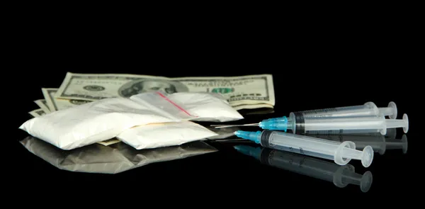 Drugs, money and syringes, isolated on black — Stock Photo, Image