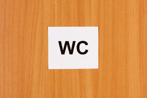 WC teken op houten achtergrond — Stockfoto