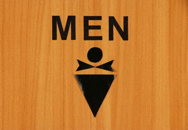Toilet sign on wooden background — Stock Photo, Image