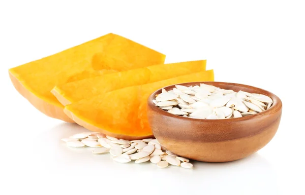 Pumpkin seeds in wooden bowl isolated on the white — Stock Photo, Image