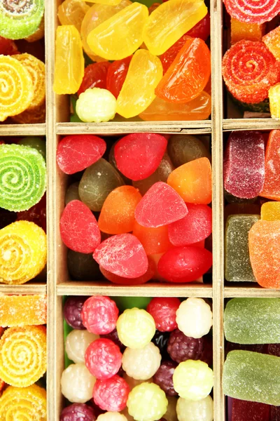 Multicolor candies in wooden box, close up — Stock Photo, Image