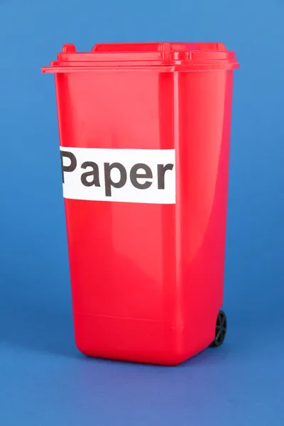 Recycling bin on blue background — Stock Photo, Image