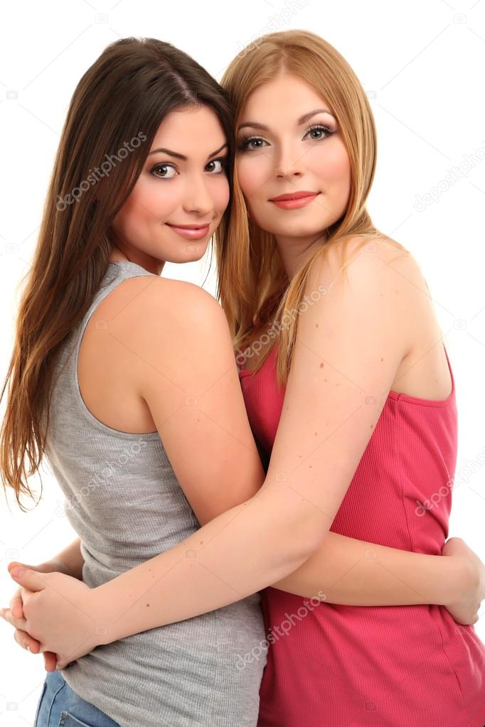 Two lesbian girls hugging and making heart