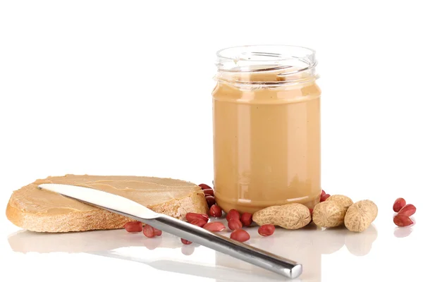 Delicious peanut butter in jar with sandwich isolated on white — Stock Photo, Image